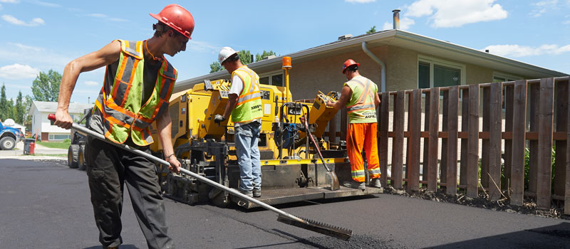 The Superior Asphalt team constructs a new residential driveway in Winnipeg