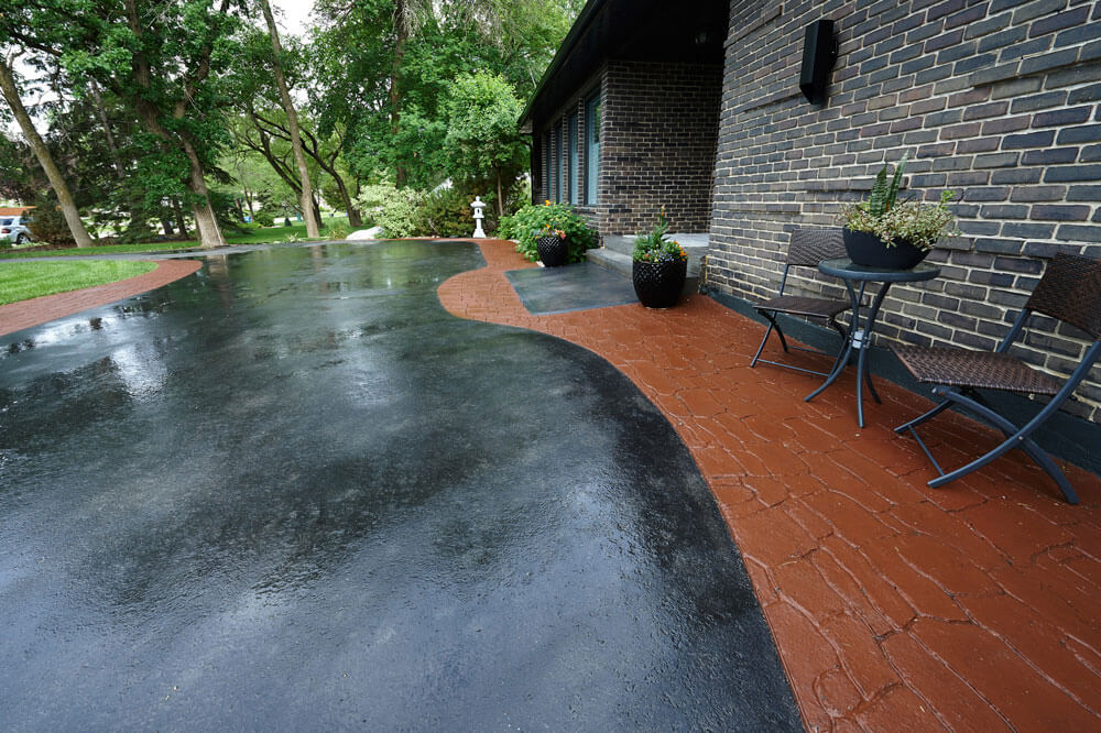 Stamped and coloured asphalt on a new driveway in Winnipeg