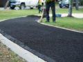 Fresh asphalt on a new walkway, installed by Superior Asphalt in Winnipeg